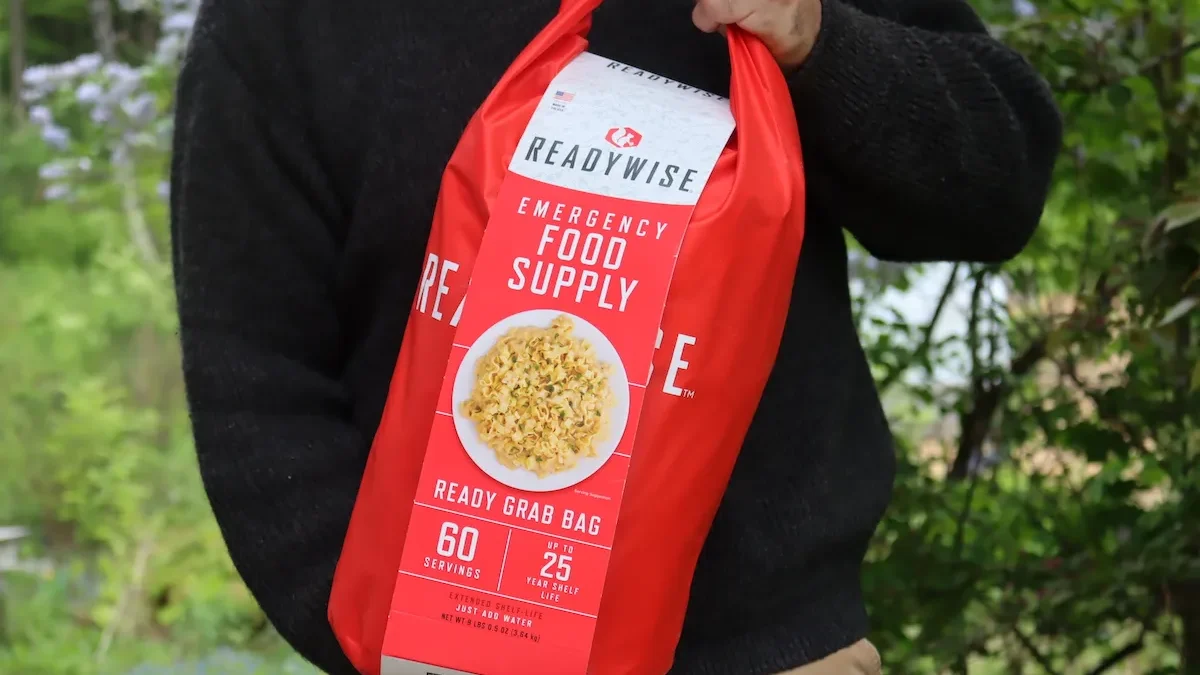man holding a emergency food grab bag